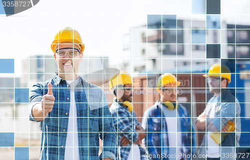 Image of group of smiling builders in hardhats outdoors