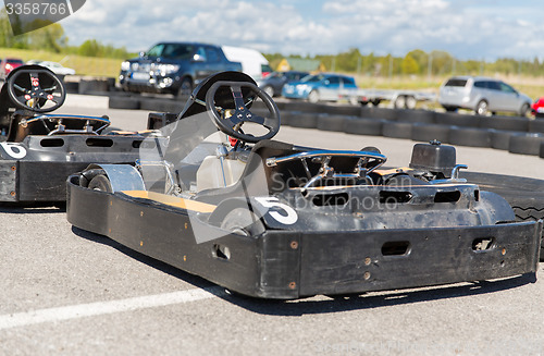 Image of close up of kart on speedway track from back