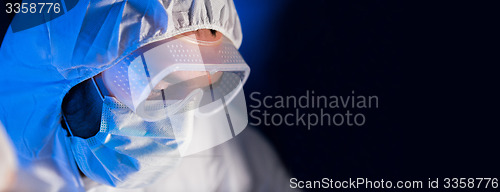 Image of close up of scientist face in chemical lab