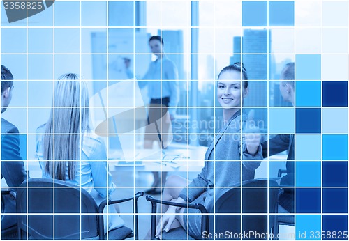 Image of businesswoman with team showing thumbs up