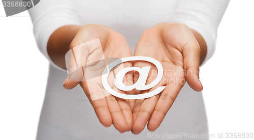 Image of womans cupped hands showing e-mail cutout sign