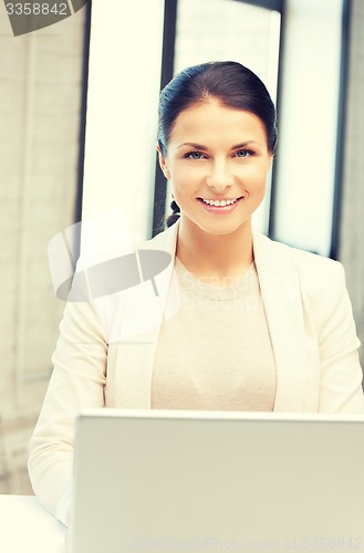 Image of happy woman with laptop computer