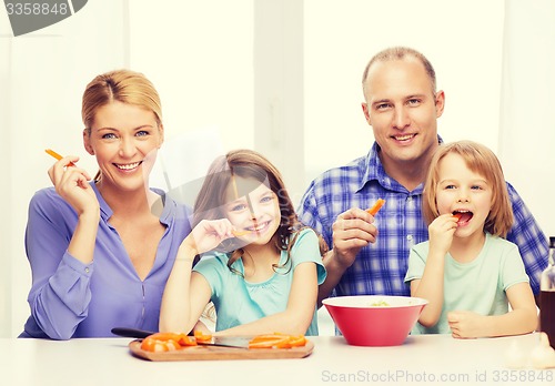 Image of happy family with two kids eating at home