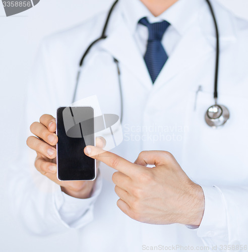 Image of doctor pointing at smartphone