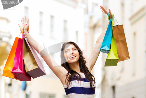 Image of woman with shopping bags in ctiy