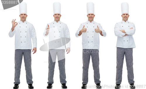 Image of happy male chef cook showing ok and thumbs up