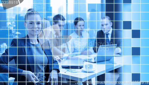 Image of businesswoman and business team at office 