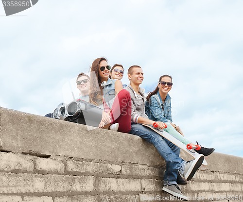 Image of group of teenagers hanging outside