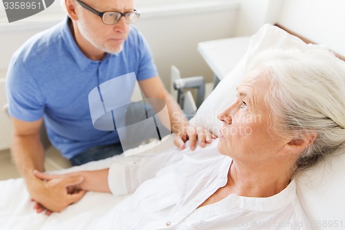 Image of senior couple meeting at hospital ward