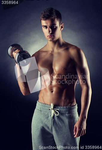 Image of young man with dumbbell