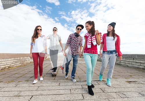 Image of teenagers with skates outside