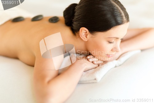 Image of woman in spa with hot stones