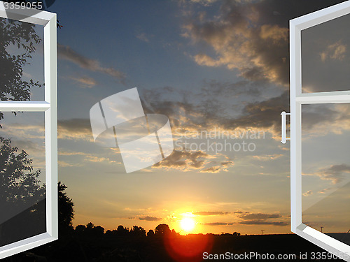 Image of window opened to the sunset