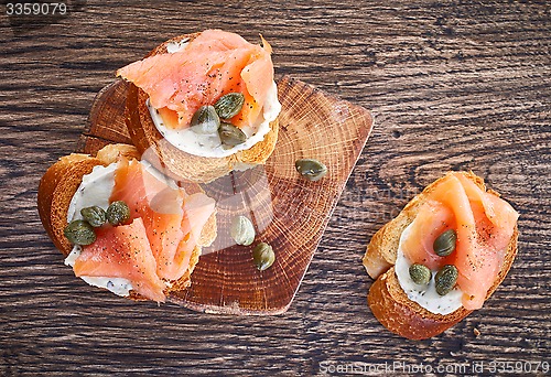 Image of toasted bread with smoked salmon fillet