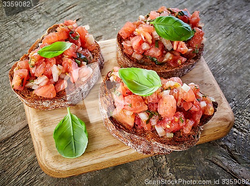 Image of toasted bread with tomato and basil