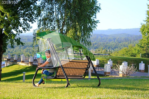 Image of Woman on swing