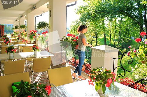 Image of Woman in outdoor restaurant