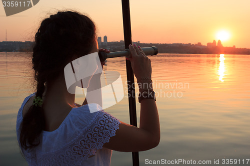 Image of Girl watching spyglass