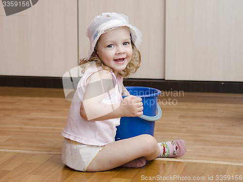 Image of Little girl wash rag floors
