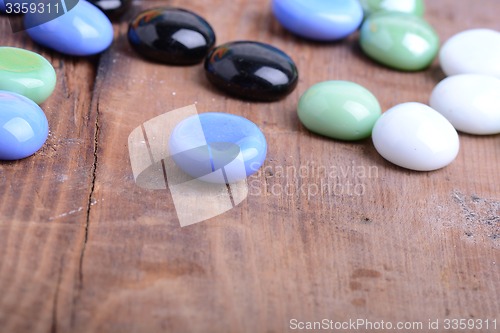 Image of spa stones on wooden table, closeup