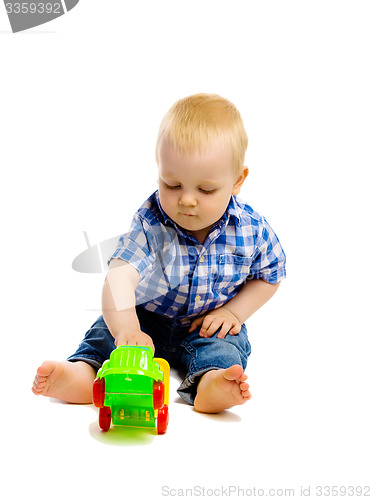 Image of little boy with toys on a white background