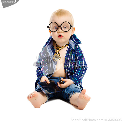 Image of little boy in a tie and glasses on a white background