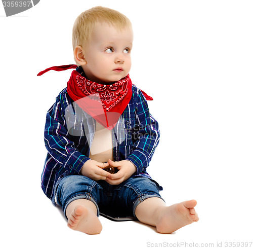 Image of Little boy in gangster kerchief around his neck on a white