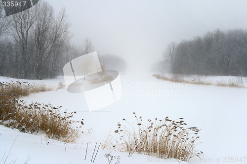 Image of Lake in misty haze of winter blizzard