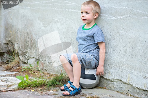 Image of Boy sitting on a ball