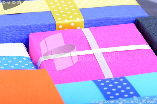 Image of bright gifts with ribbons, holiday invitation card