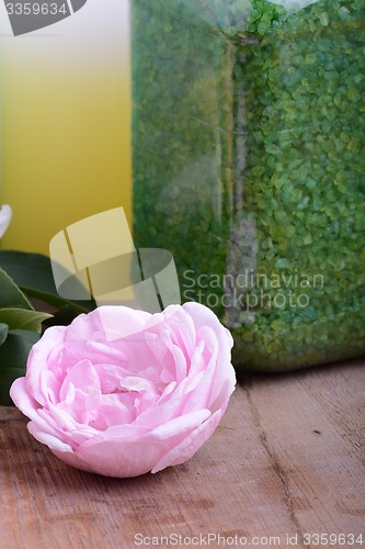 Image of Spa theme with candles and flowers on wooden background