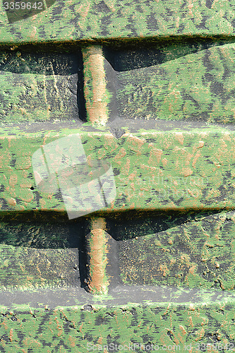 Image of Old rusty green corrugated metal wall