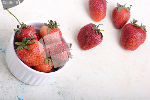 Image of Close up strawberry on old watercolor plate