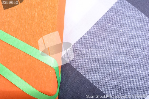 Image of orange gift box with green ribbon
