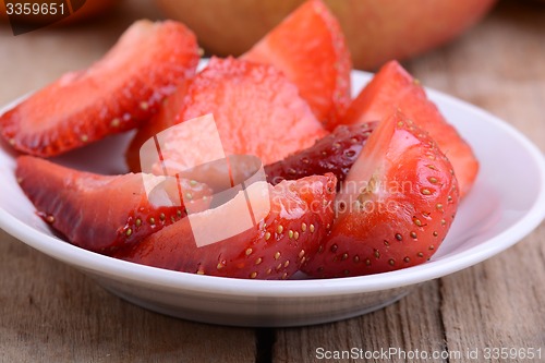 Image of Chopped strawberry in a white bowl