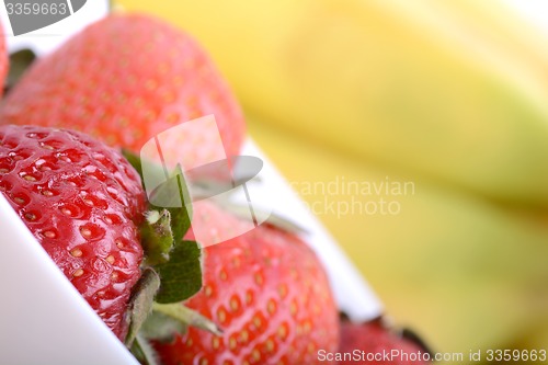 Image of healthy strawberry smoothie with fruits on wooden background