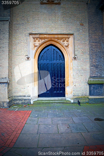 Image of brown wooden parliament in london old  door and marble antique  