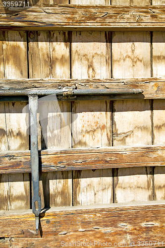 Image of rusty  brown    morocco in africa  wood  facade and safe padlock
