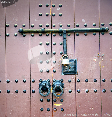 Image of rusty  brown    morocco in africa the old wood  facade home and 