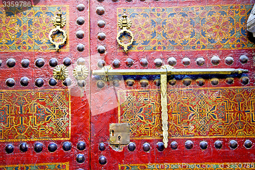 Image of metal rusty  brown    morocco in africa   and safe padlock 