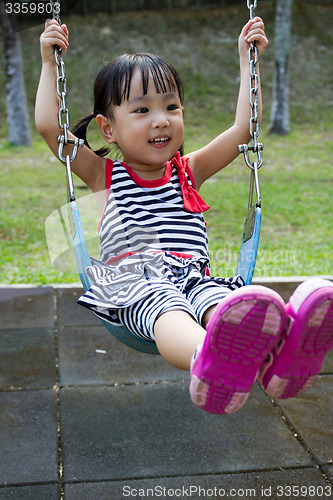 Image of Asian Kid Swing At Park