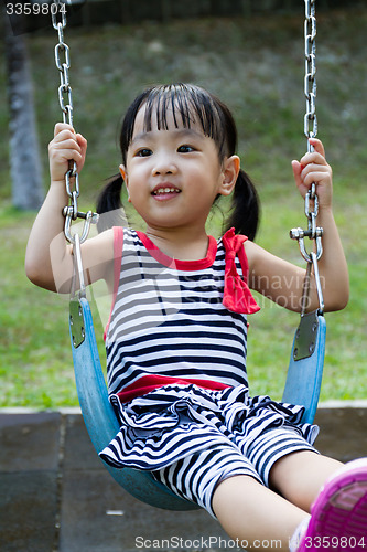 Image of Asian Kid Swing At Park