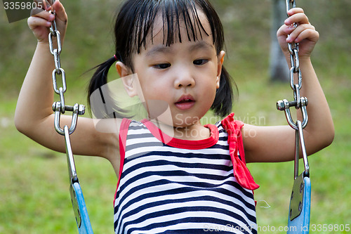 Image of Asian Kid Swing At Park