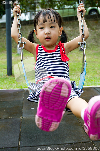 Image of Asian Kid Swing At Park