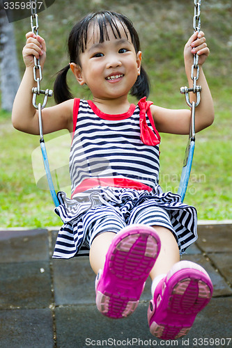 Image of Asian Kid Swing At Park