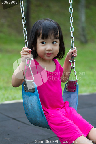 Image of Asian Kid Swing At Park