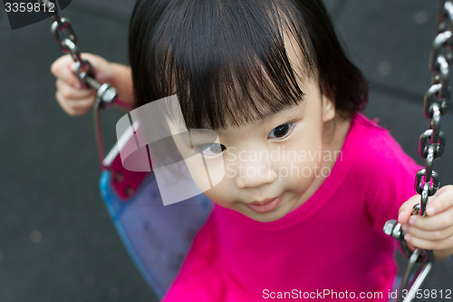 Image of Asian Kid Swing At Park