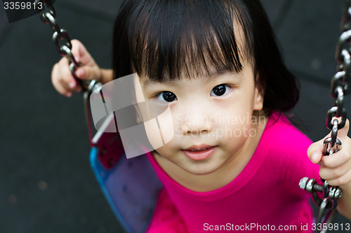 Image of Asian Kid Swing At Park