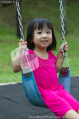 Image of Asian Kid Swing At Park