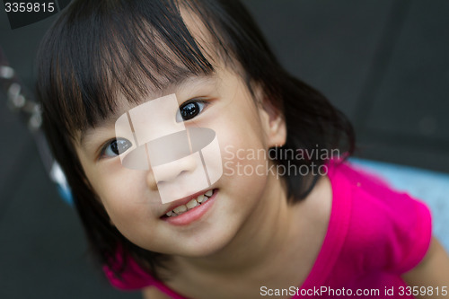 Image of Asian Kid Swing At Park